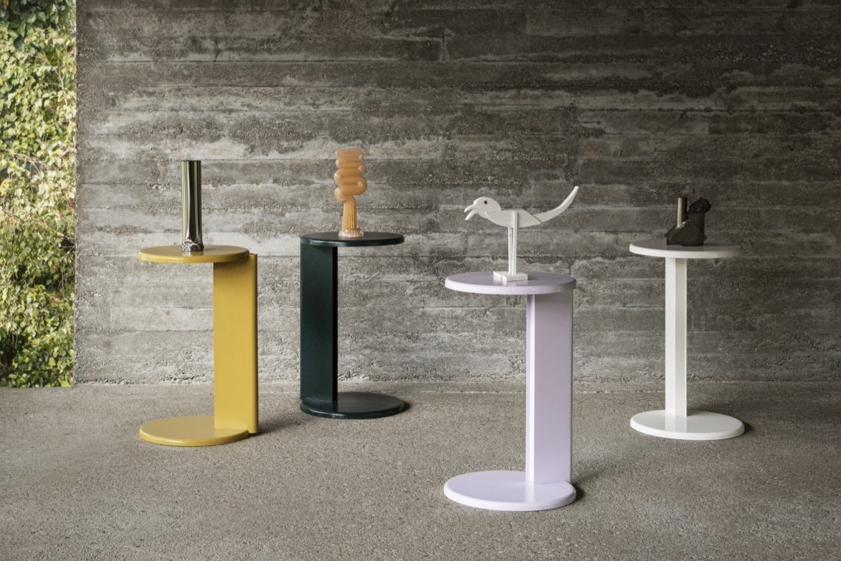 A landscape image featuring 4 Lolly Side Tables in Ochre Yellow, Black Green, Powder Violet and Pure White.