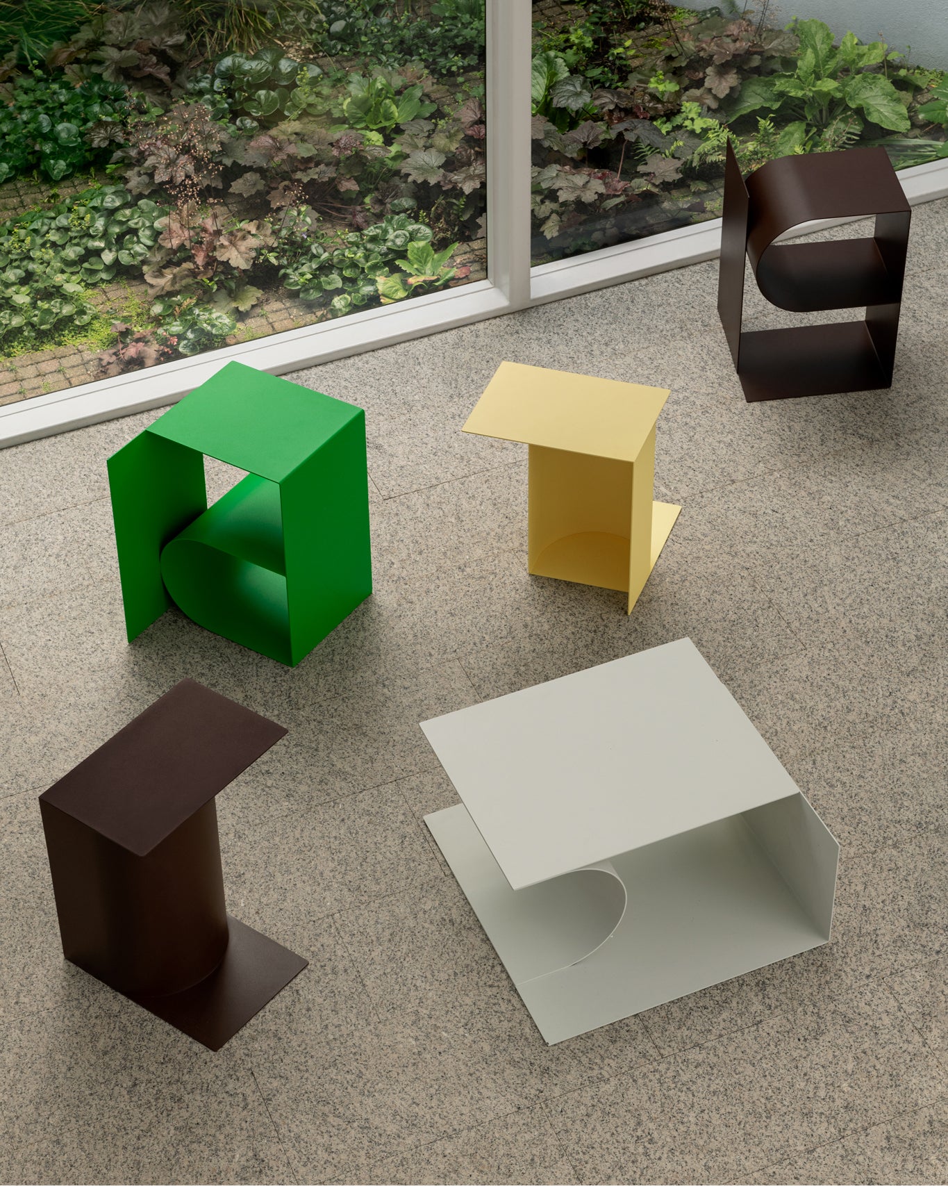 A lifestyle image of the Glyph Side Tables Alpha, Beta and Gamma.