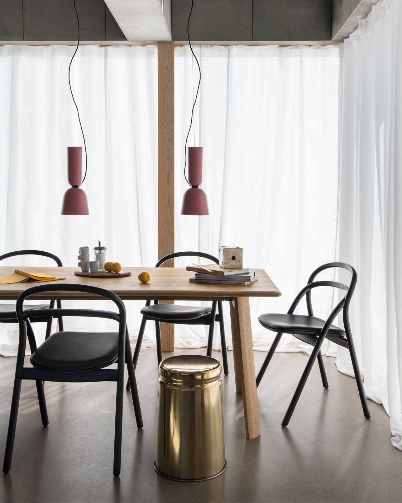 A dining room scene featuring two pink Alphabeta Pendant Lights over the table.