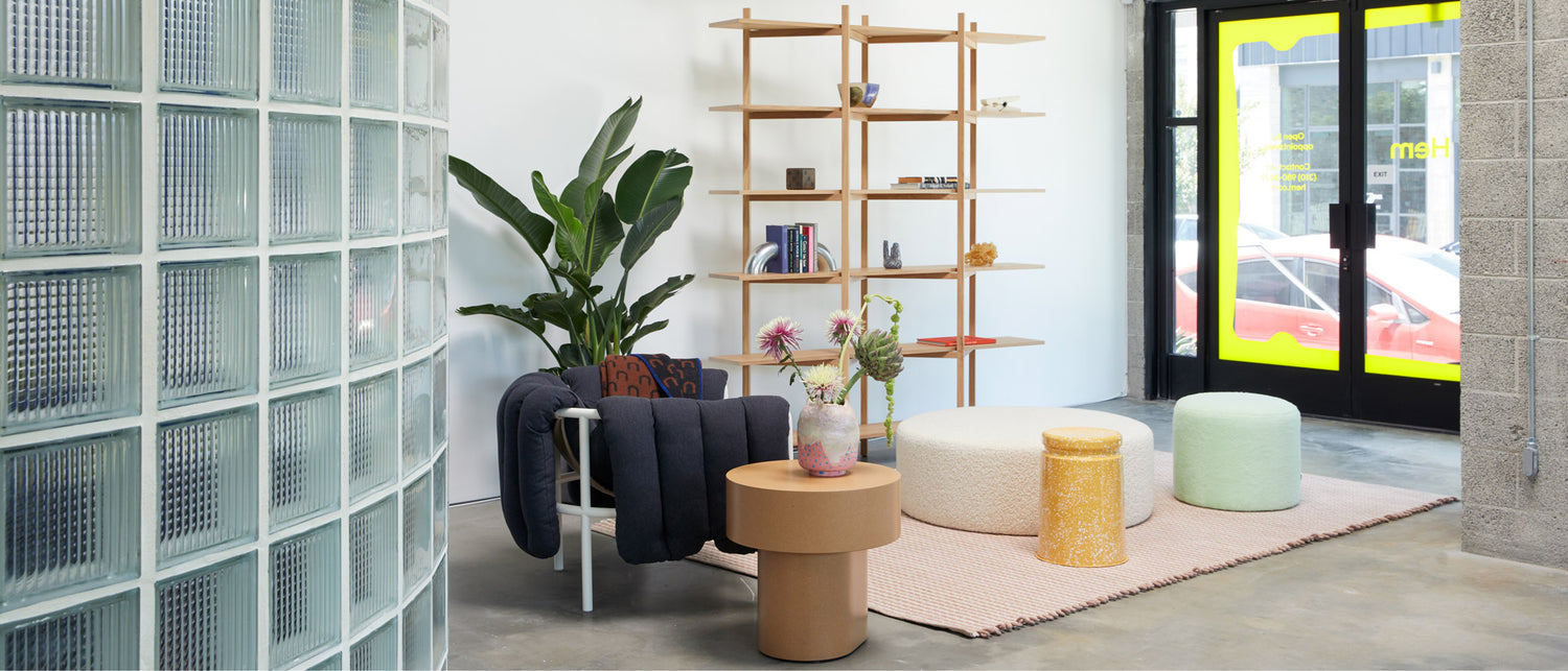 Hem - An image from our LA Showroom featuring Boa Pouf, Puffy Lounge Chair, Zig Zag High Shelf, Rope Rug Large, Stump Table, Bon Pouf Round Large, and more.
