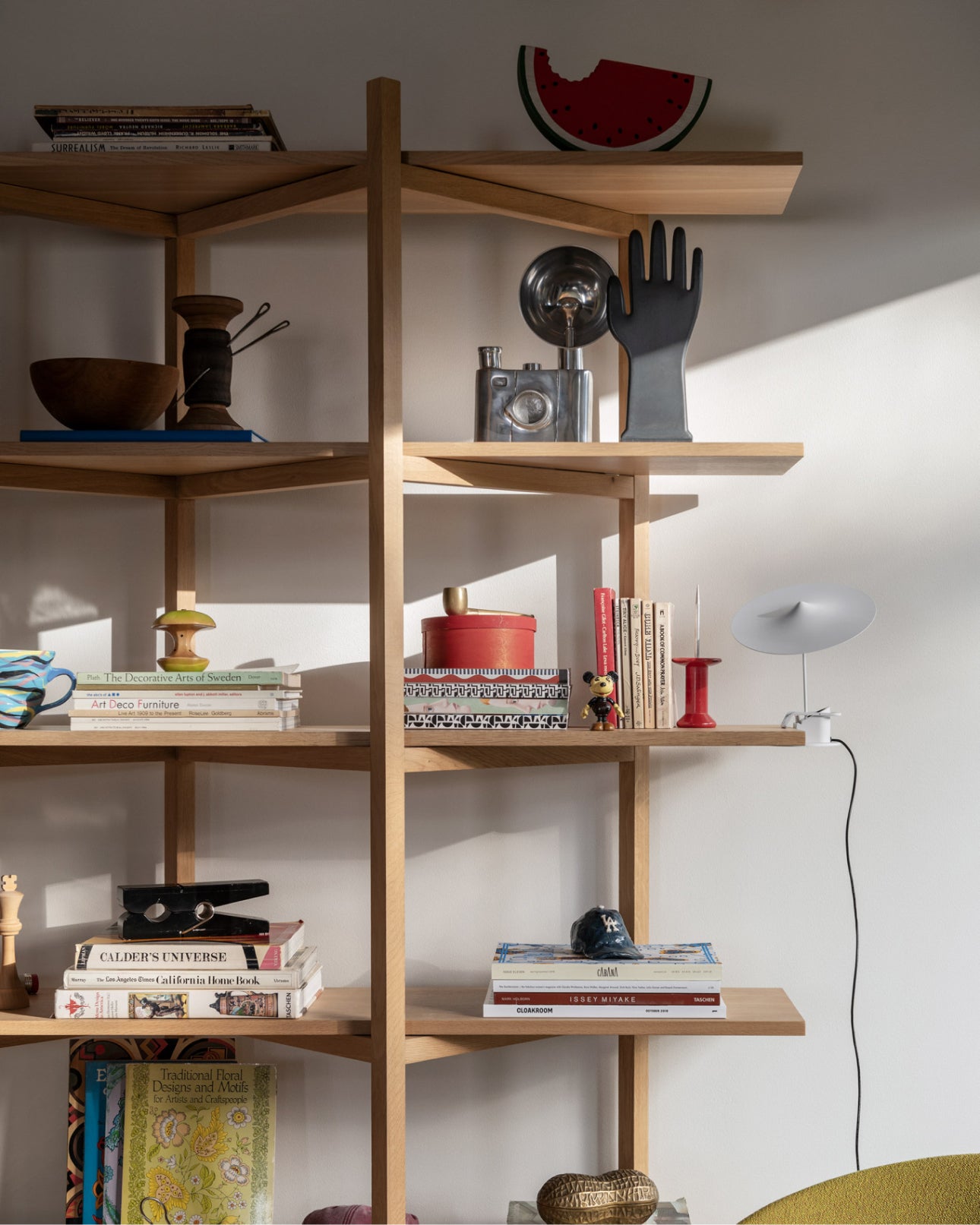 Close-up of Zig Zag High Shelf in Oak with accessories on the shelves